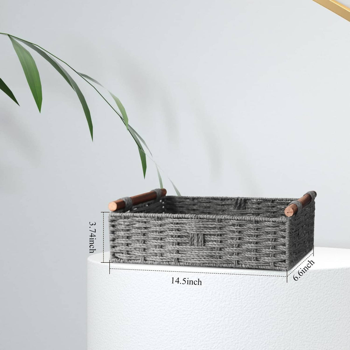 Grey woven rectangular storage basket with wooden corner handles; side view with dimensions.