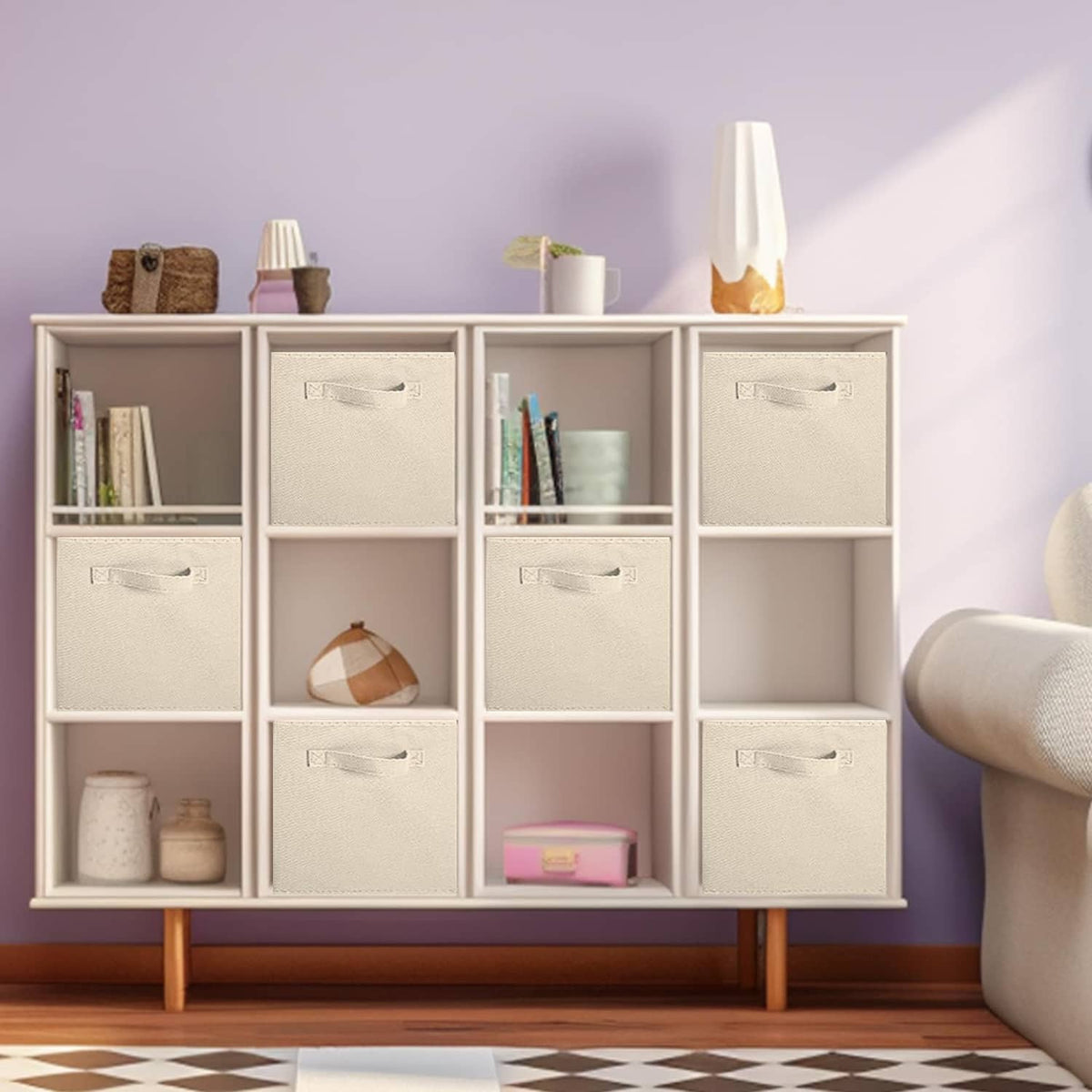 Beige foldable storage cubes with pull handles in a cubby shelf unit