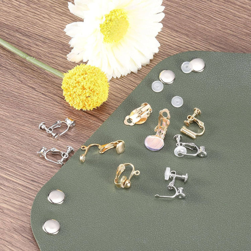 Assorted clip-on earring converters with mixed-tone metal clips and white silicone pads