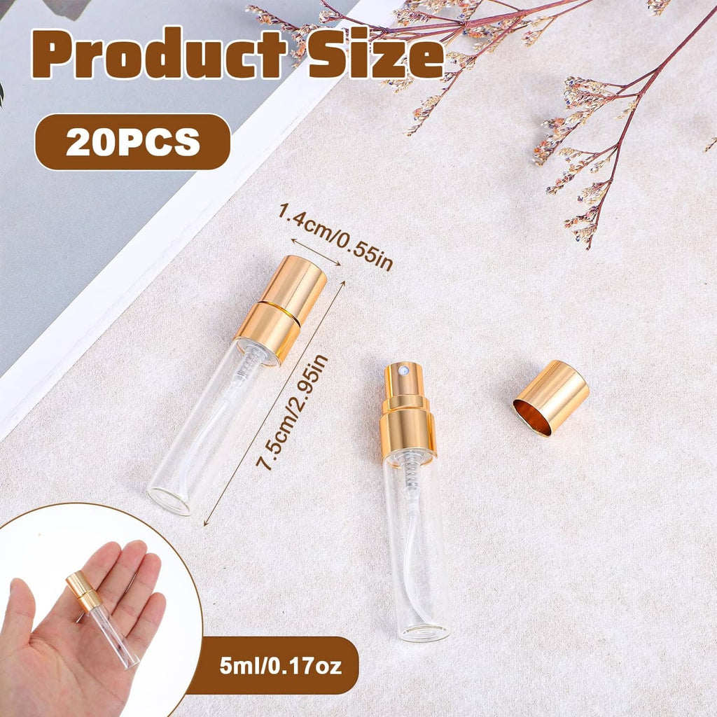 Mini clear glass perfume atomizer bottle with gold cap, shown in hand with others