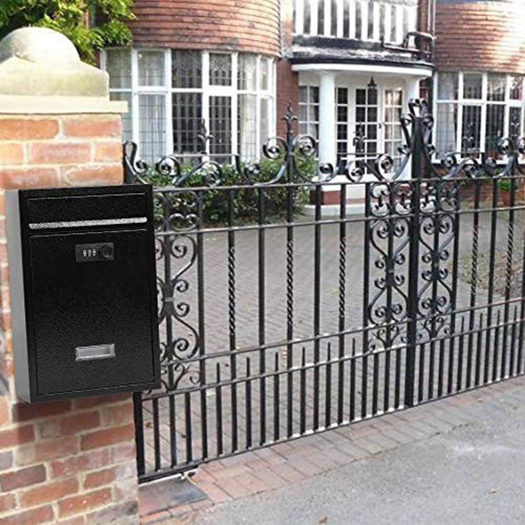 Black wall-mount mailbox with combination lock installed on wrought-iron fence