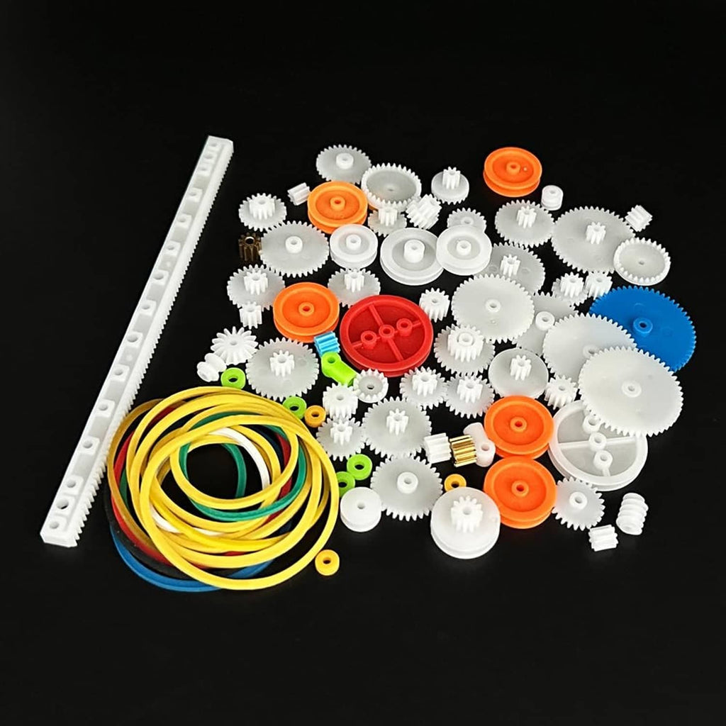 Plastic gear and pulley kit with scattered white gears and long yellow belt loop