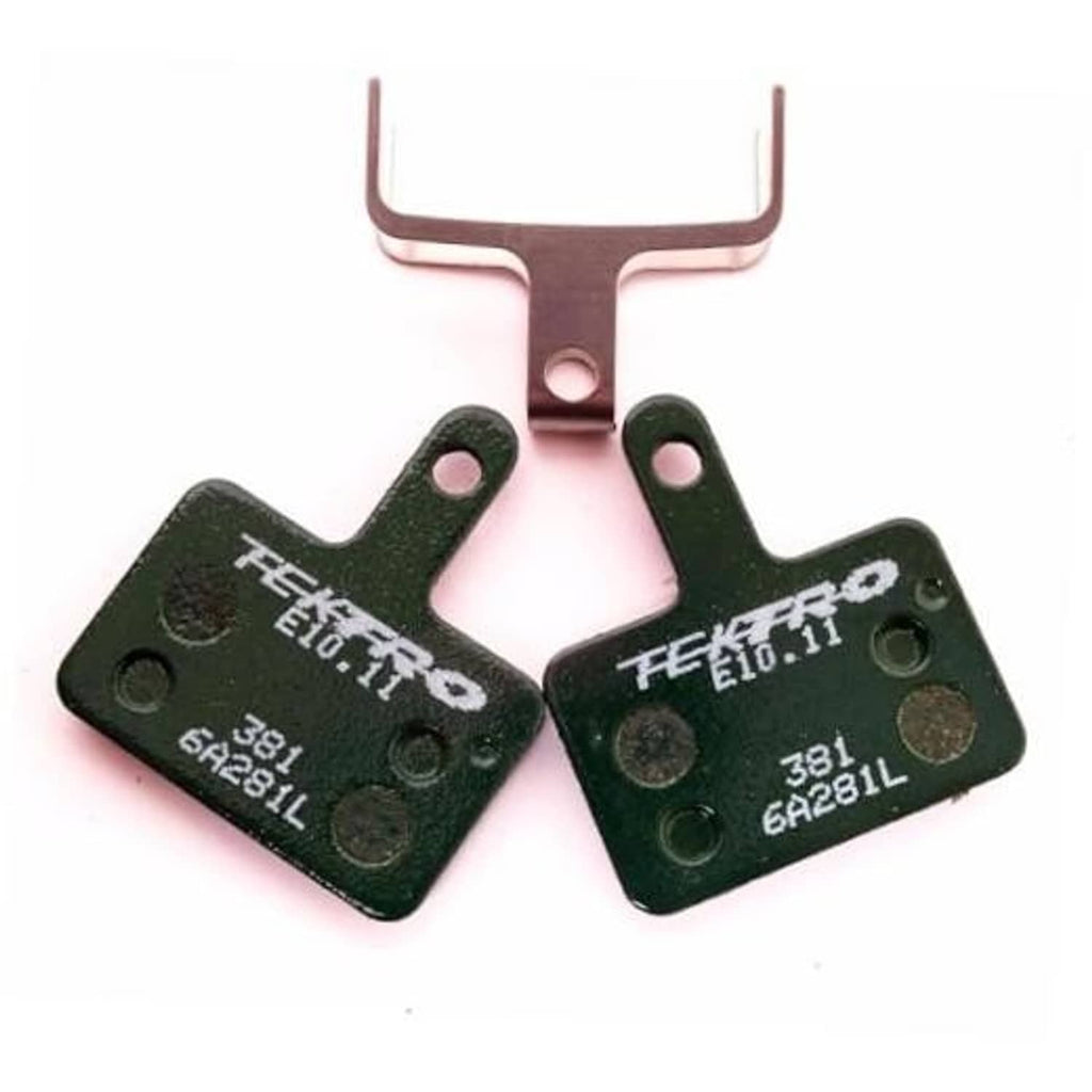 Resin disc brake pads set with two green pads and metal backing plates