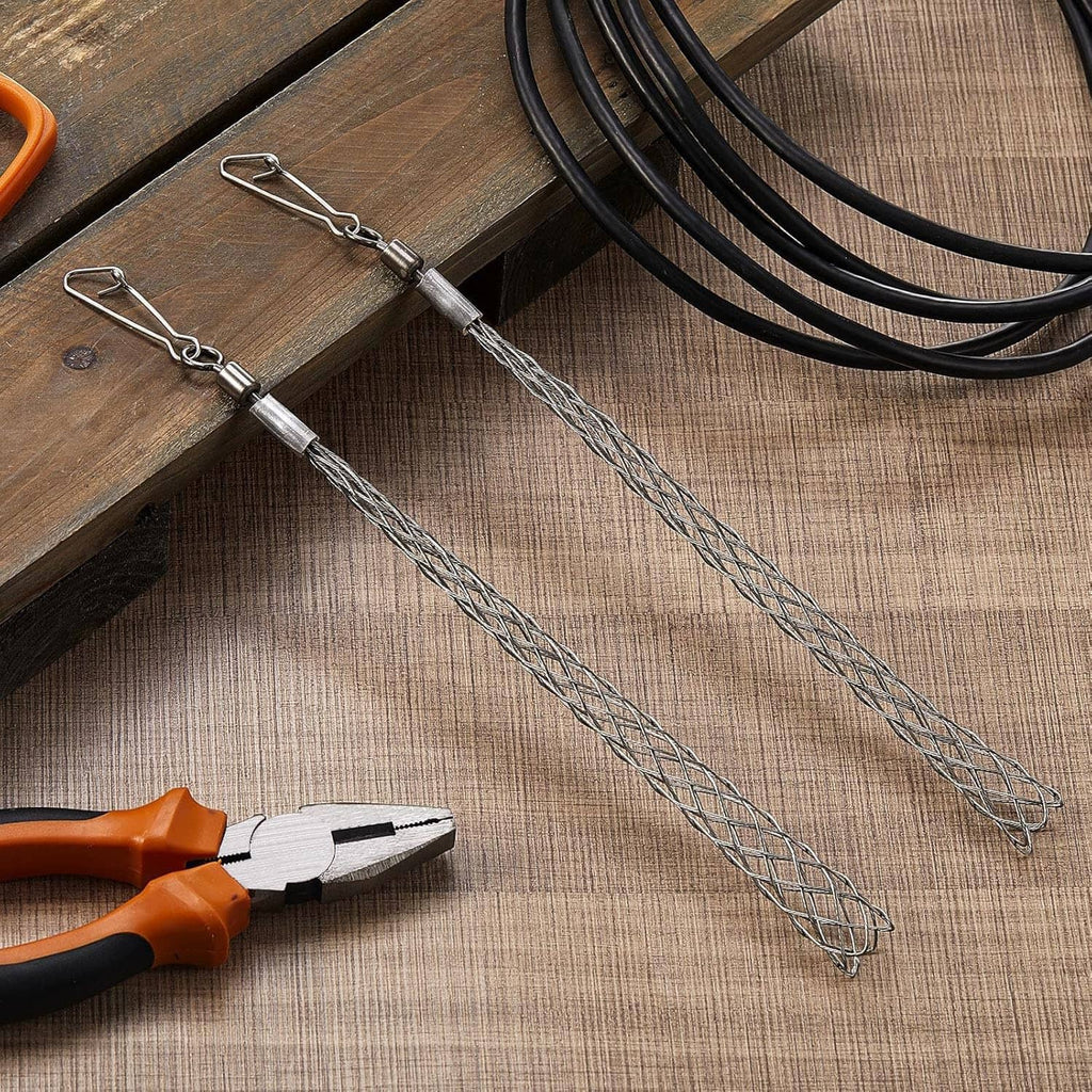 Wire pulling grip mesh cable pullers laid on wood with metal handles and loop hooks