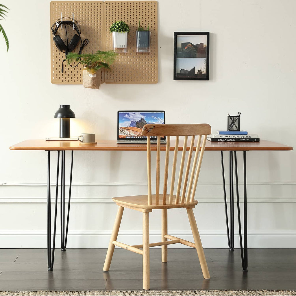 Black steel table legs under a wooden tabletop in a living room scene