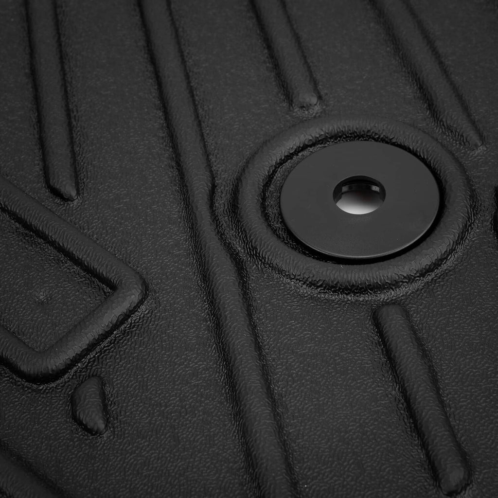 Close-up of black floor mat with grommet hole on textured anti-slip surface