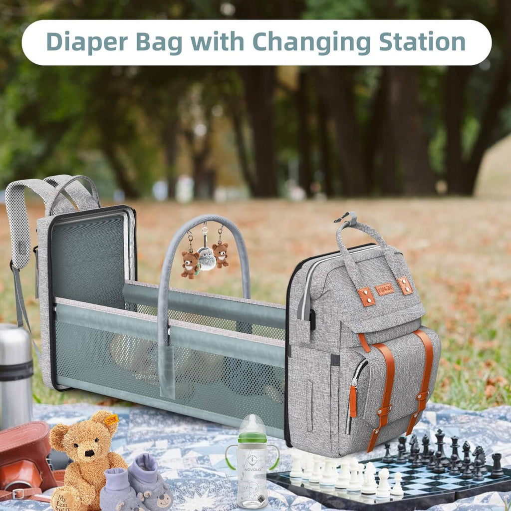 Dark grey diaper bag backpack with fold-out changing station and mesh storage panel