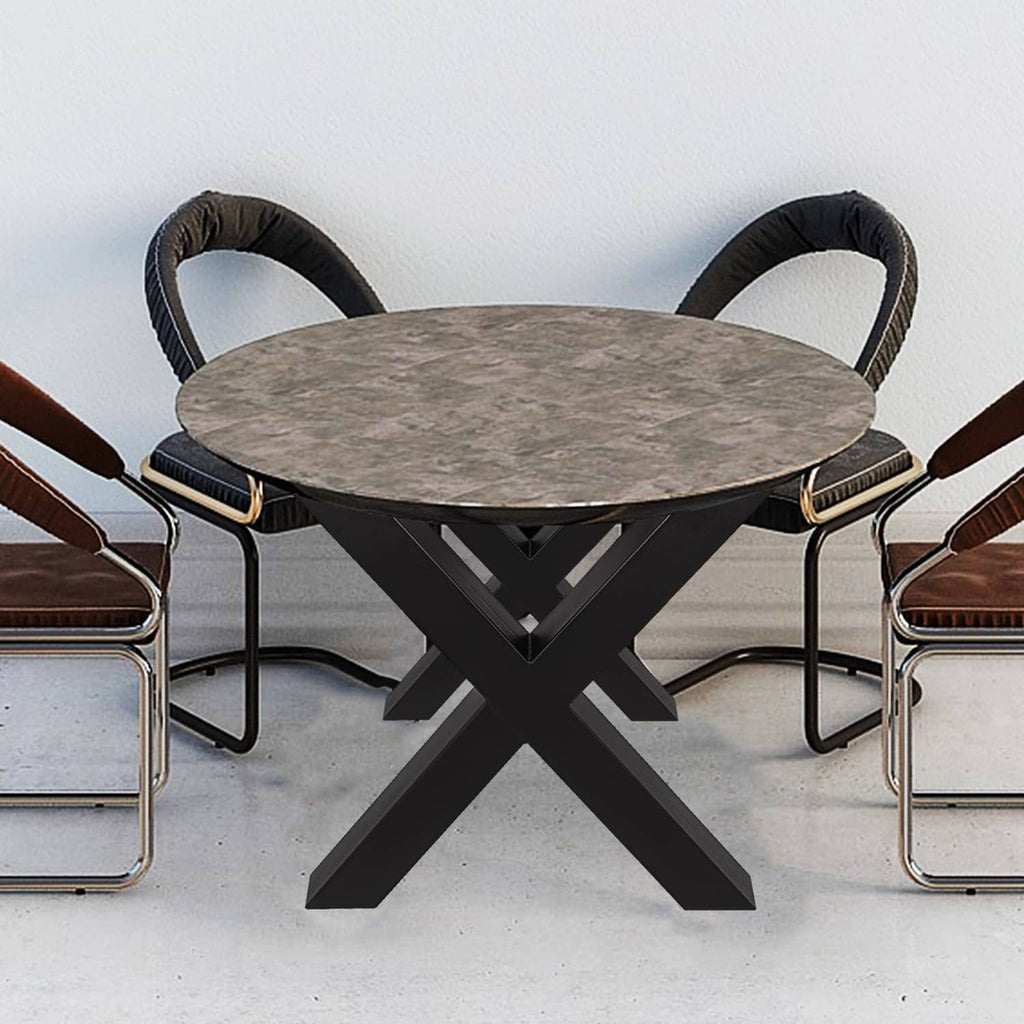 Black X-frame metal dining table leg base under a round tabletop