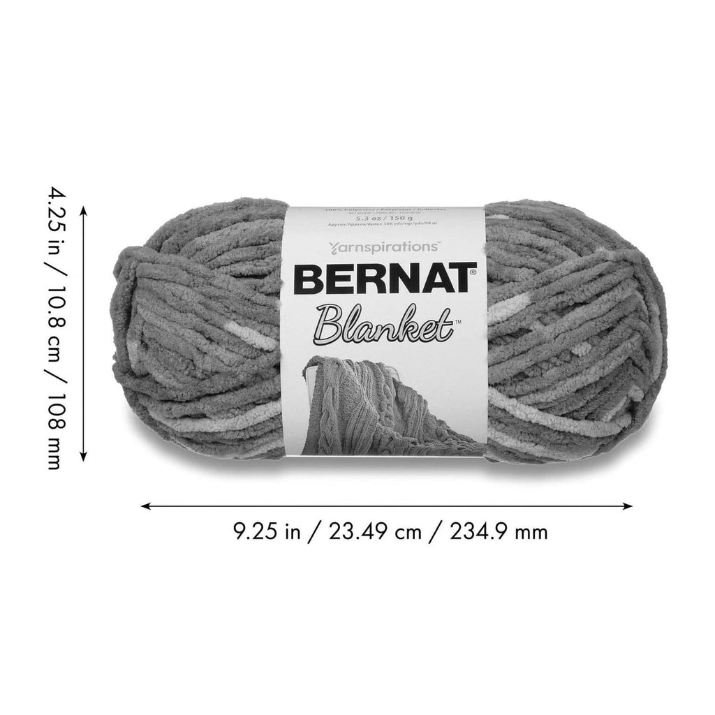 Dark gray bulky chenille yarn skein with Bernat Blanket label and size arrows