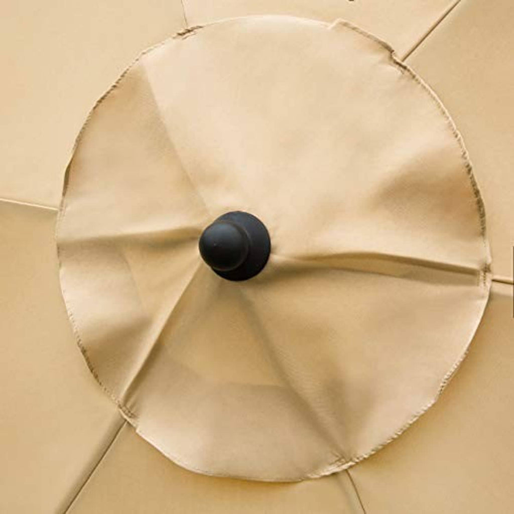 Tan umbrella top vent with black knob, close-up of fabric panels