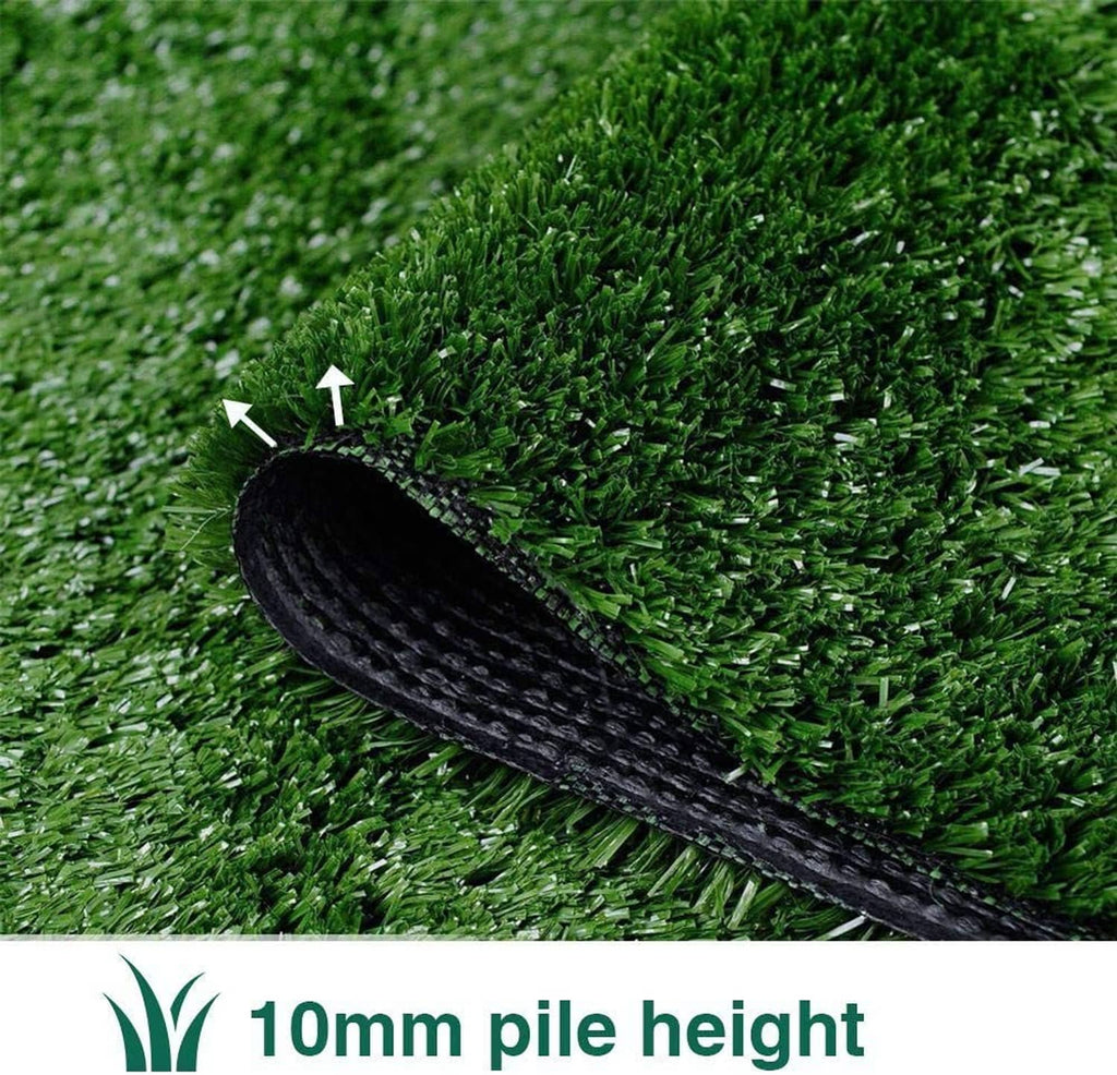 Green artificial turf with a rolled-up corner, showing black textured backing layer
