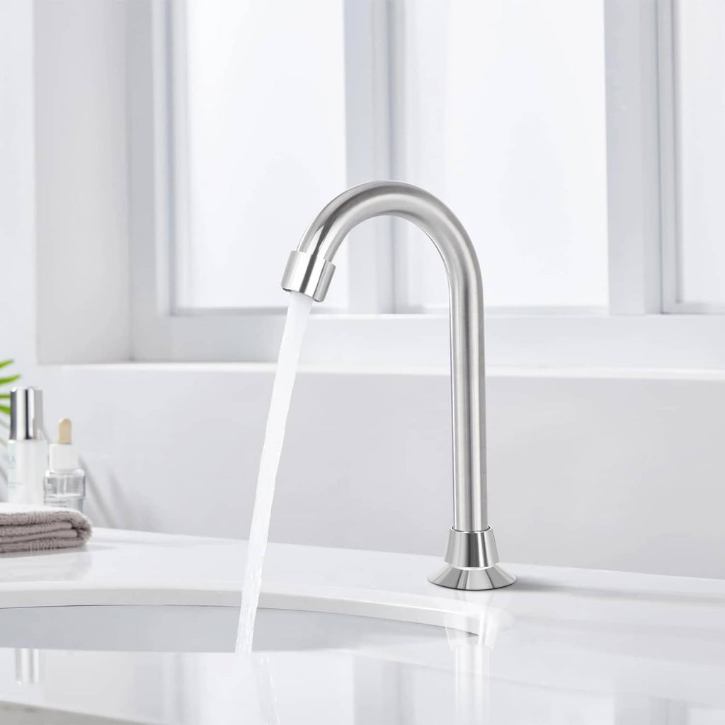 Chrome floor-mount sink faucet with curved spout and running water stream