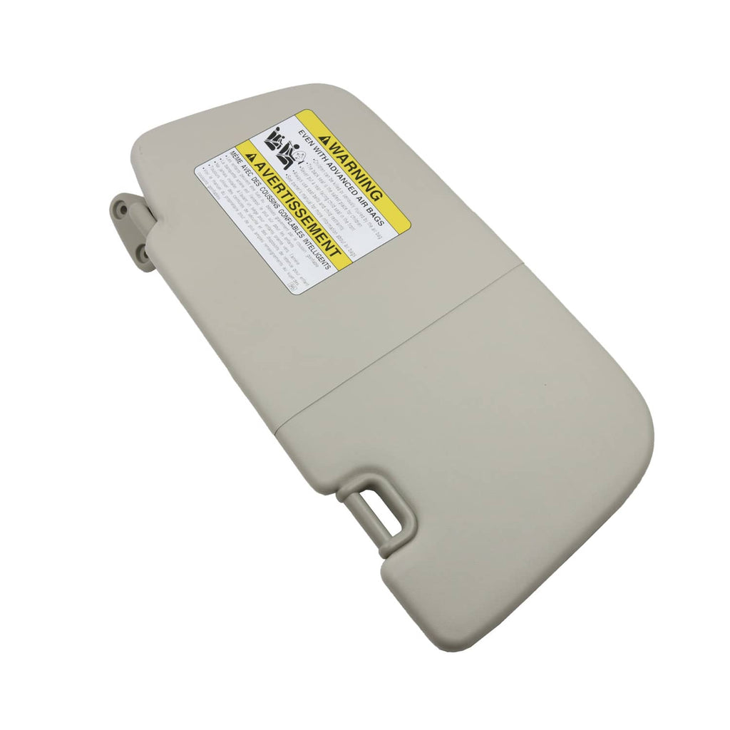 Light gray sun visor with warning label and mounting hardware