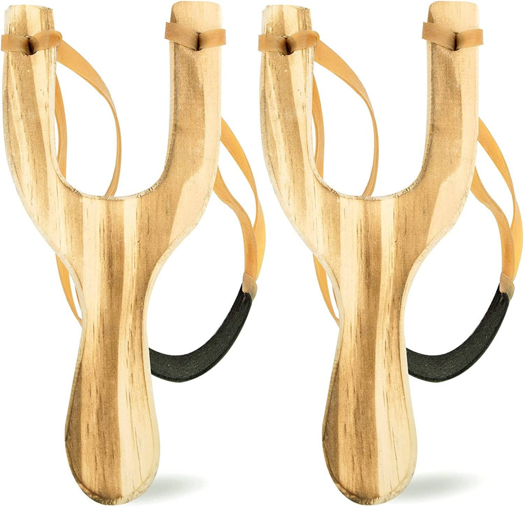 Two wooden slingshots showing forked frame, tan straps, and dark rubber band