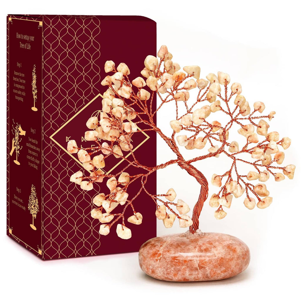 Sunstone crystal tree ornament with red wire branches and orange-pink stone base