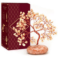 Sunstone crystal tree ornament with red wire branches and orange-pink stone base