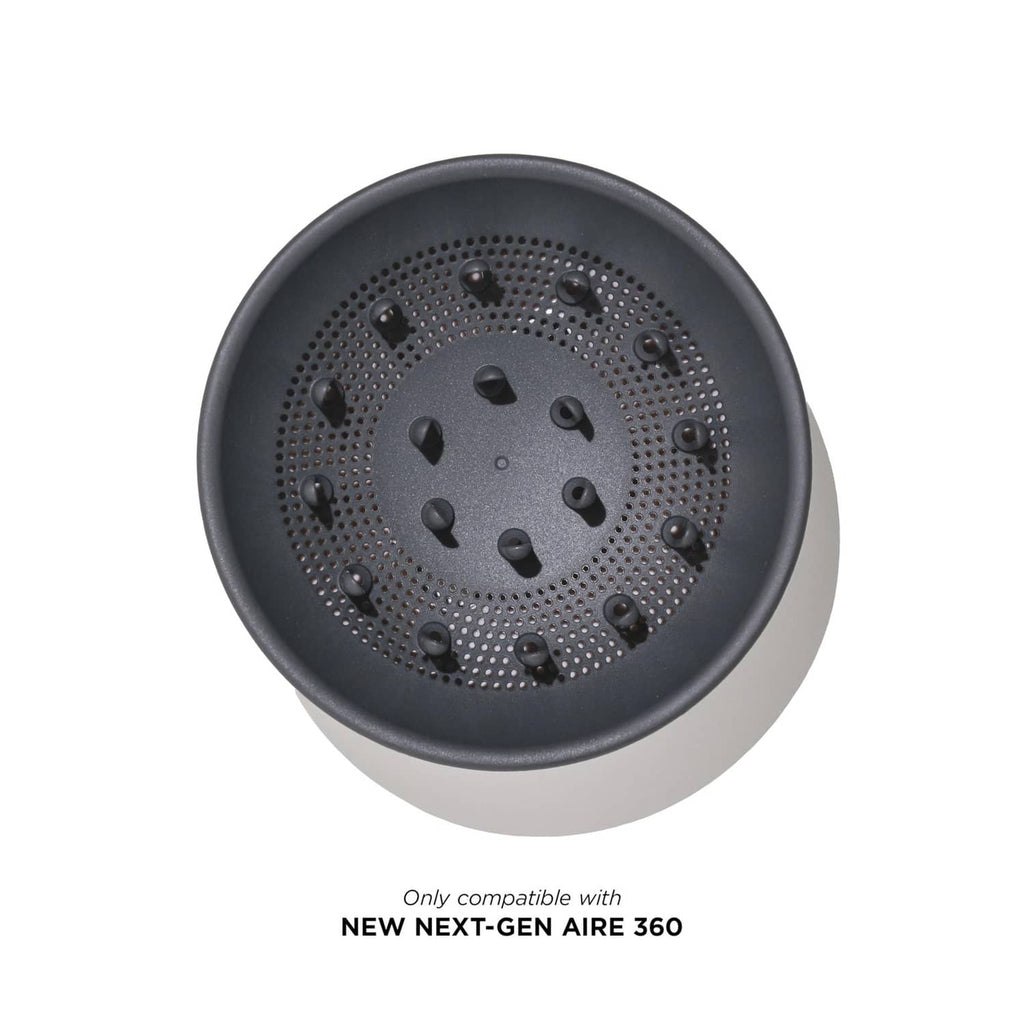 Round dark gray diffuser plate with perforations and central vent holes