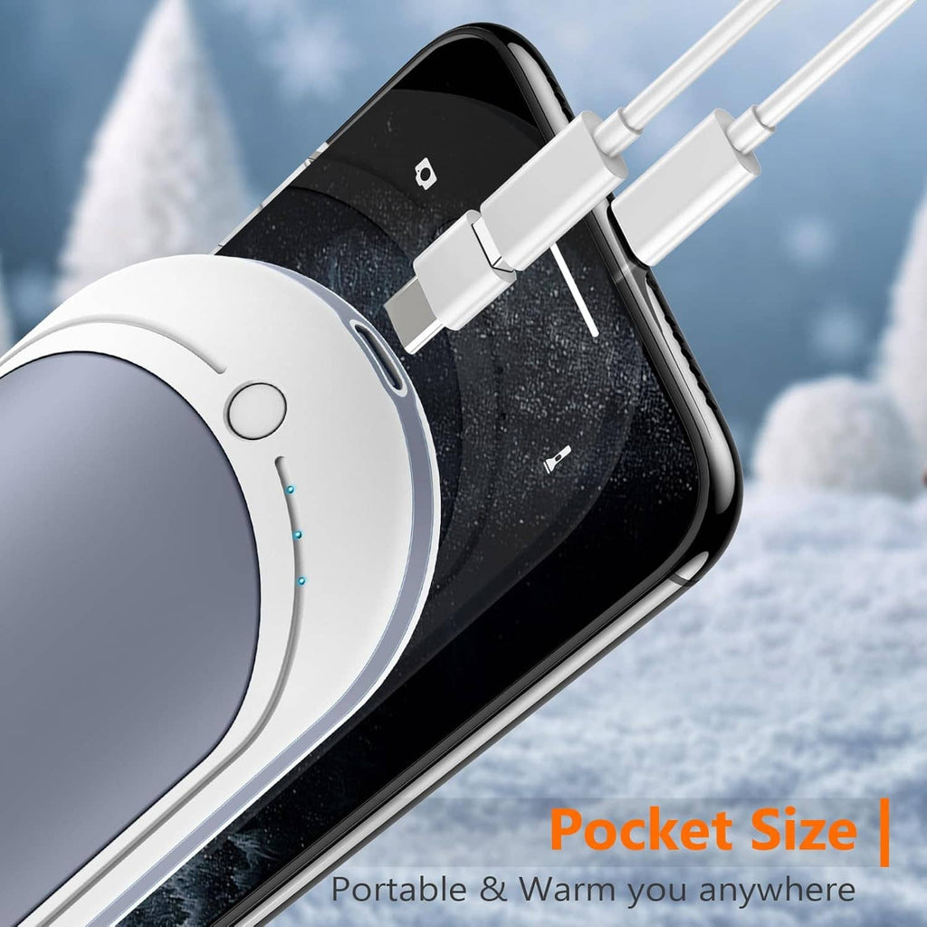 Hand warmer with water droplets on dark gray surface, charging cable connected to port