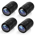 Set of 4 black tire valve stem caps with blue Subaru star emblem, textured grip.