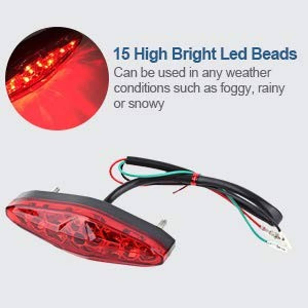 Red LED motorcycle tail light with black housing and attached wire leads