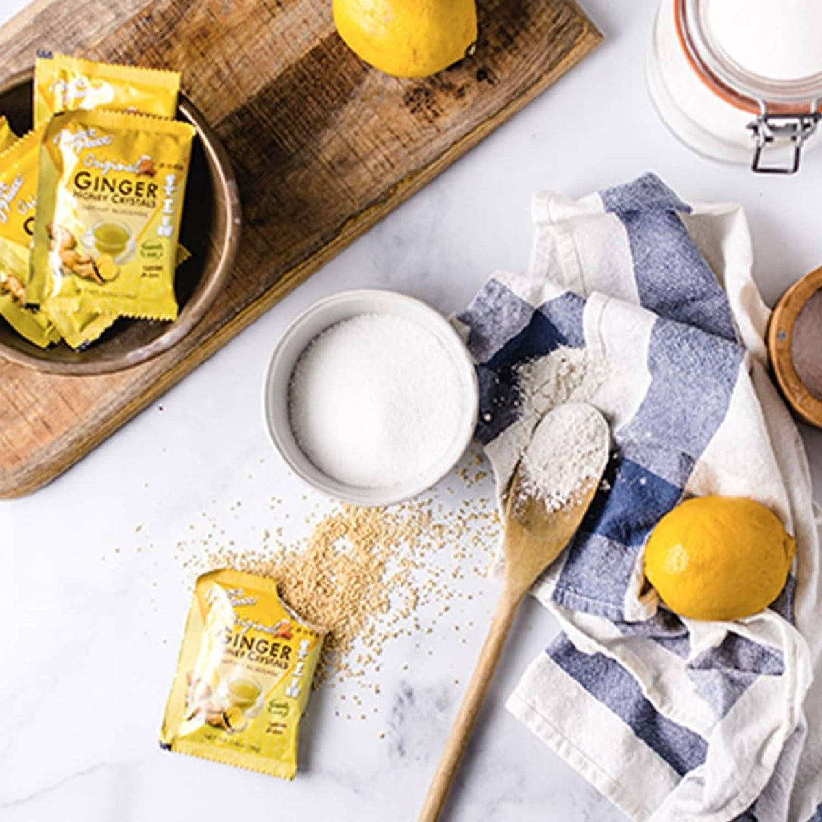 Ginger honey crystals sachet packets with measured crystal powder in a cup