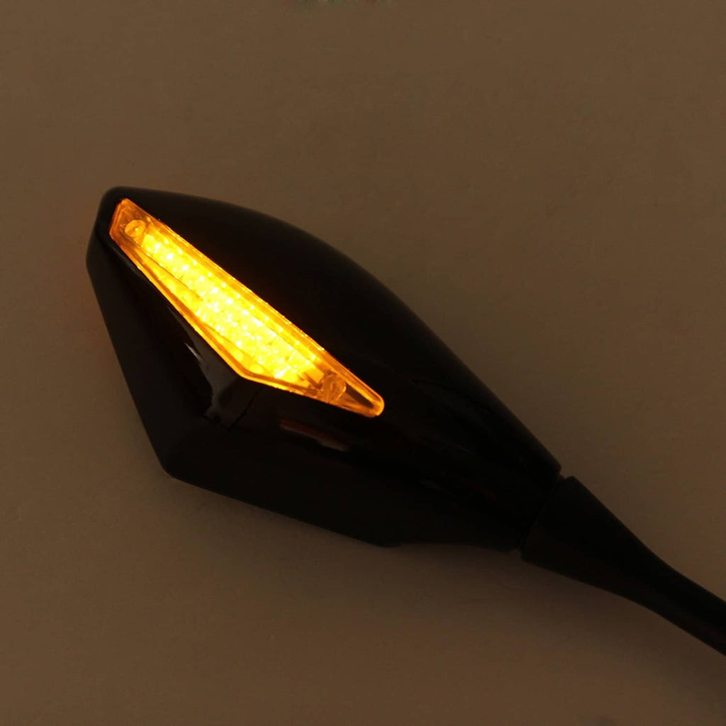 Close-up of black LED turn signal lens showing bright amber light