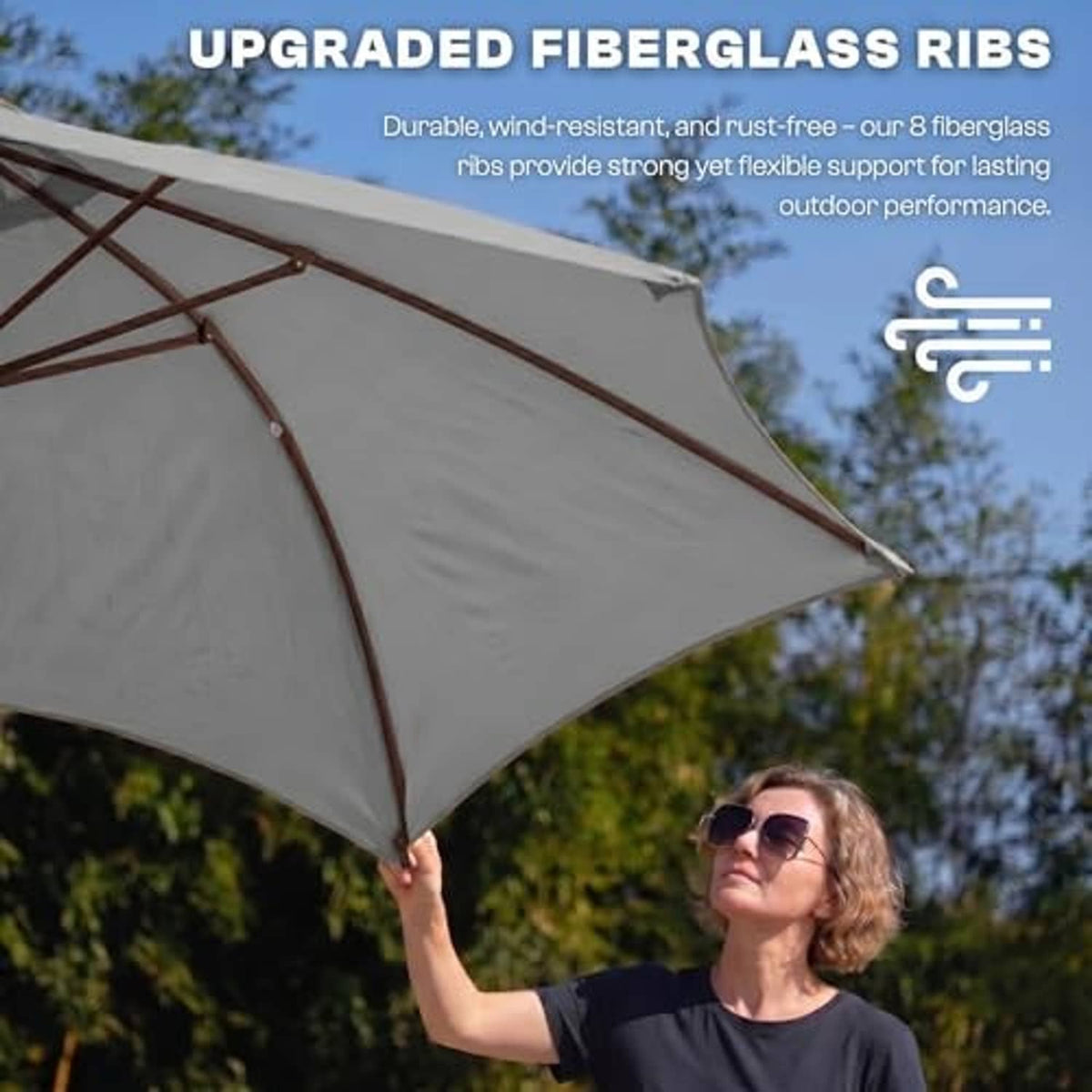 Light gray patio umbrella underside with cross ribs and fabric panels