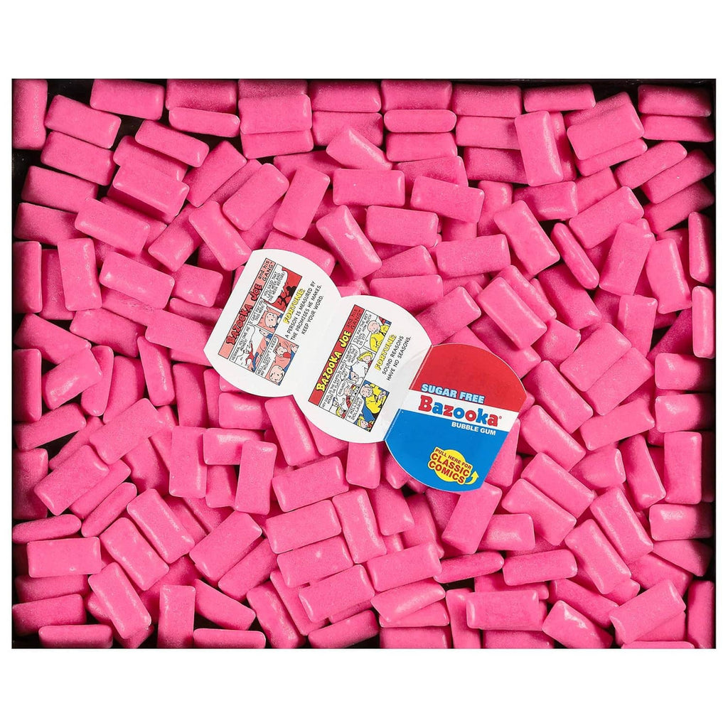 Pink sugar-free bubble gum pellets piled, with Bazooka package label