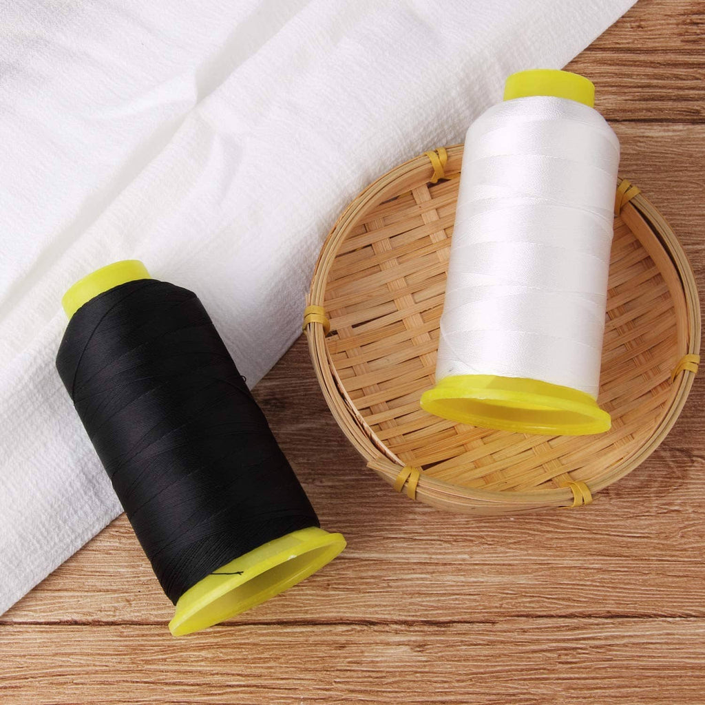 Two bonded nylon sewing thread spools: black and white, yellow caps