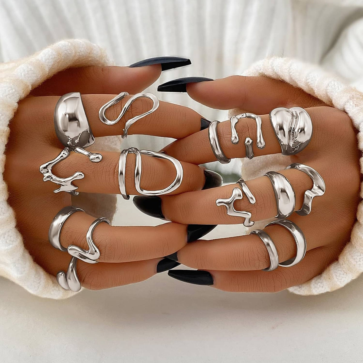 Silver chunky ring set on cushioned pouch, assorted thick bands with sculpted details