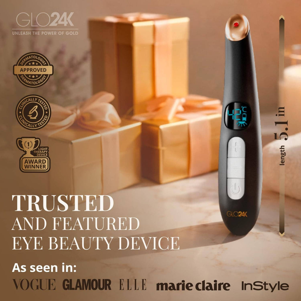 GLO24K heated eye wand standing upright with blue LED display and gold-toned cap