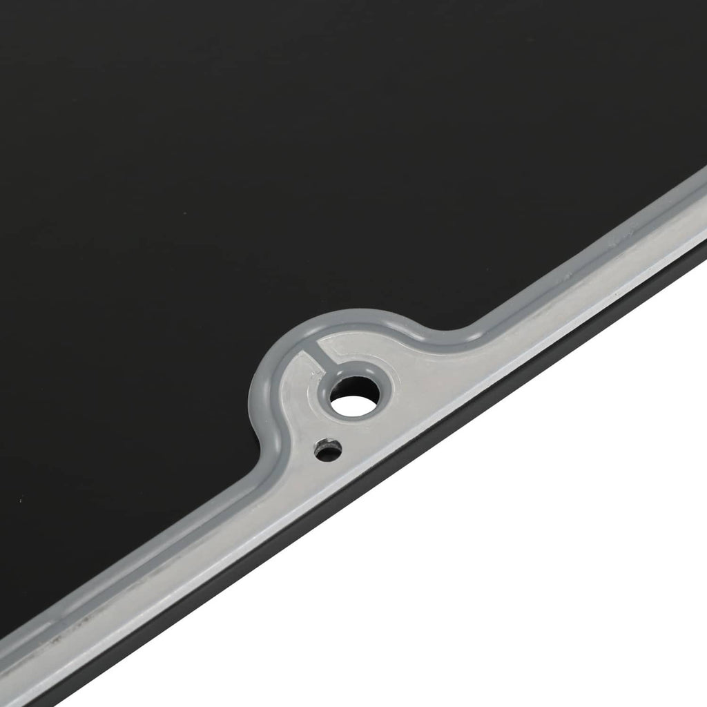 Round mounting hole on black gasket surface with silver border