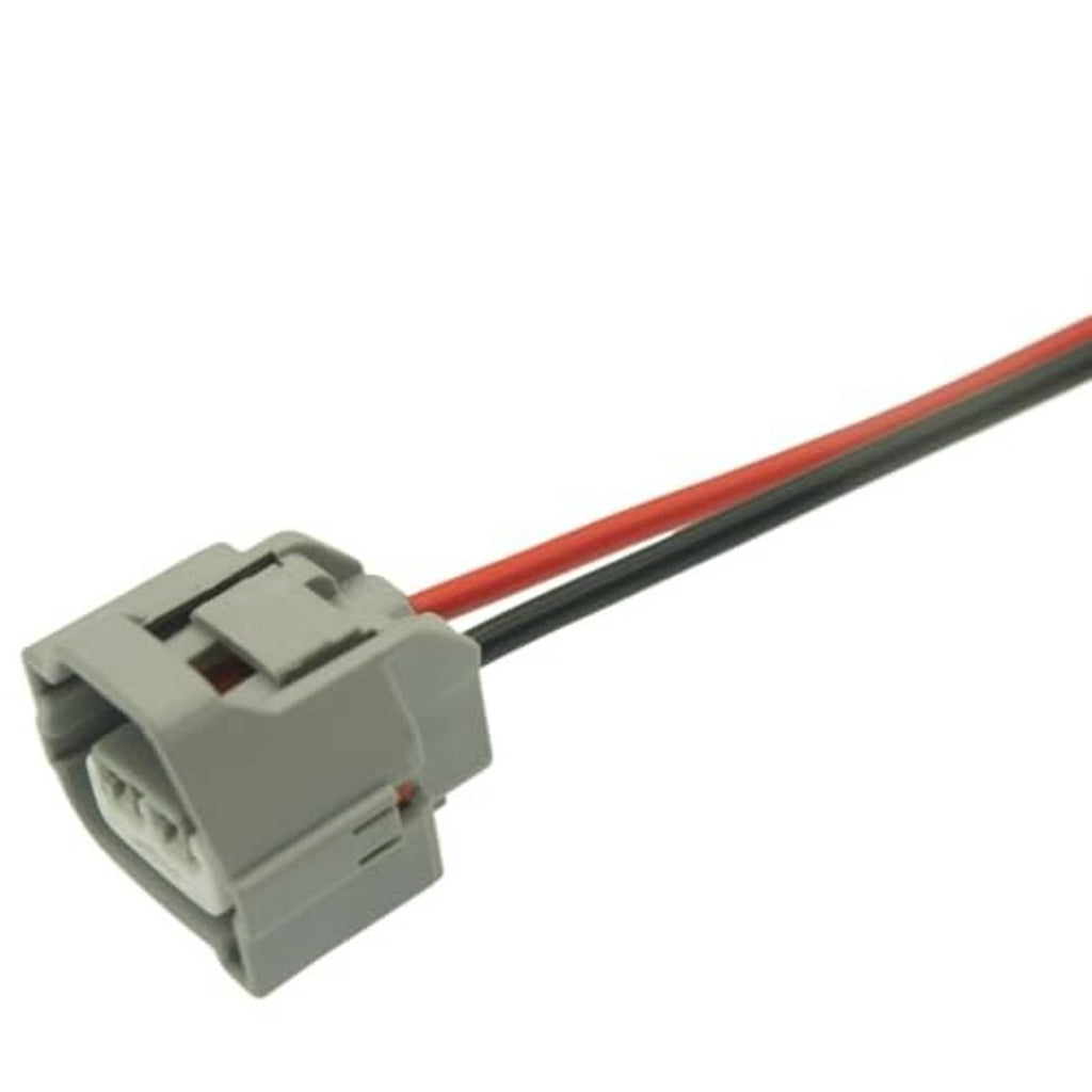 Gray AC compressor plug connector with red and black wires and terminal opening
