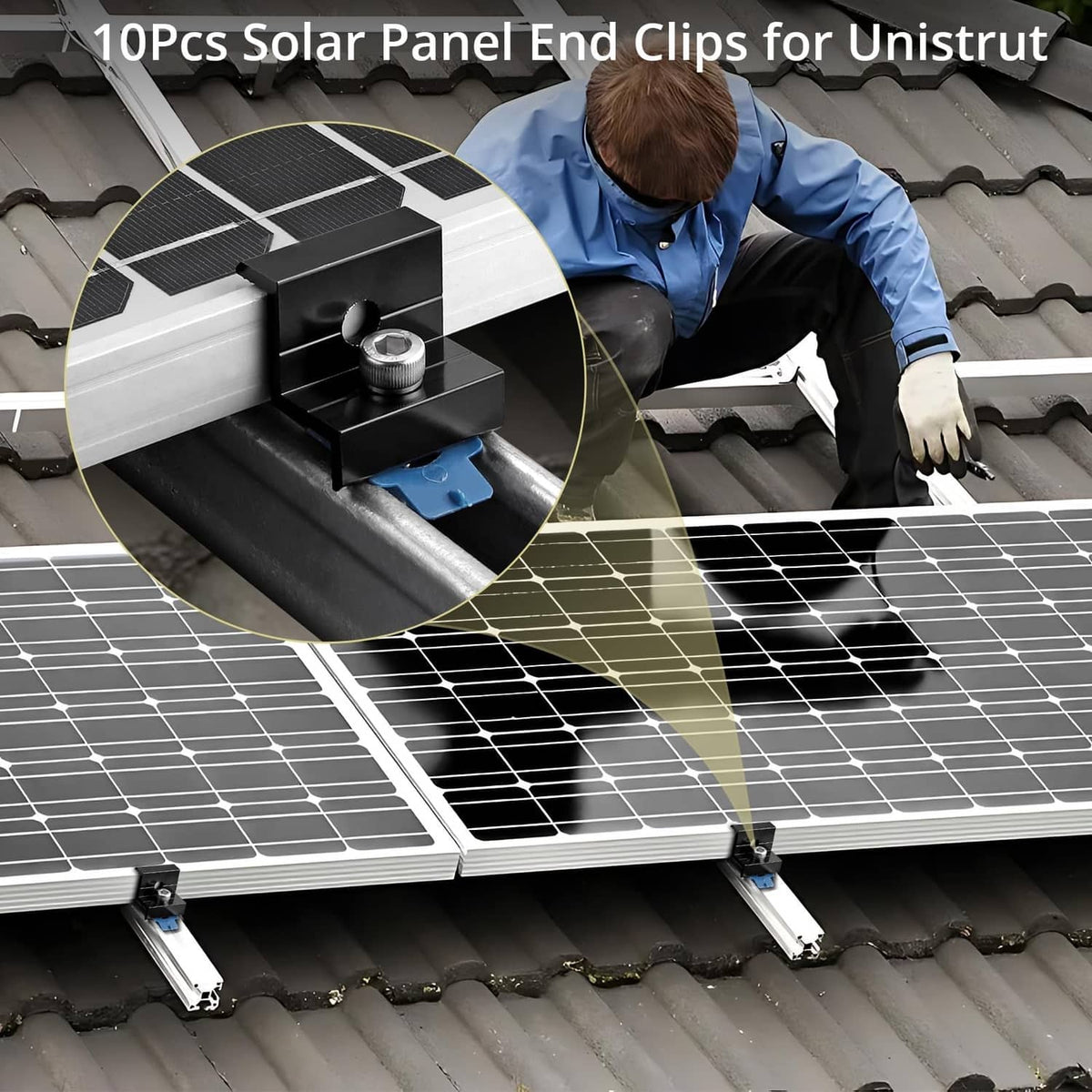 Black solar panel end clamp securing a solar panel to a metal roof rail