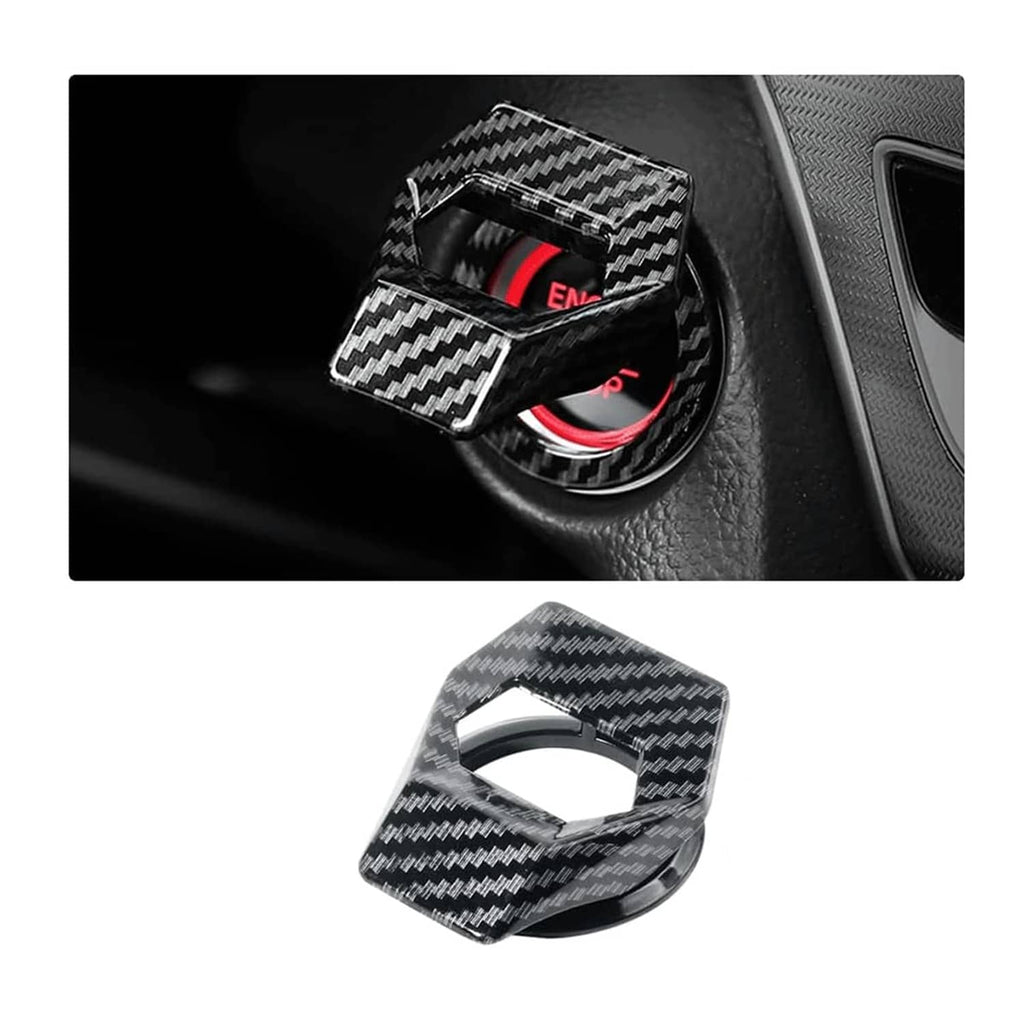 Carbon fiber engine start/stop button cover with textured black weave, installed on car