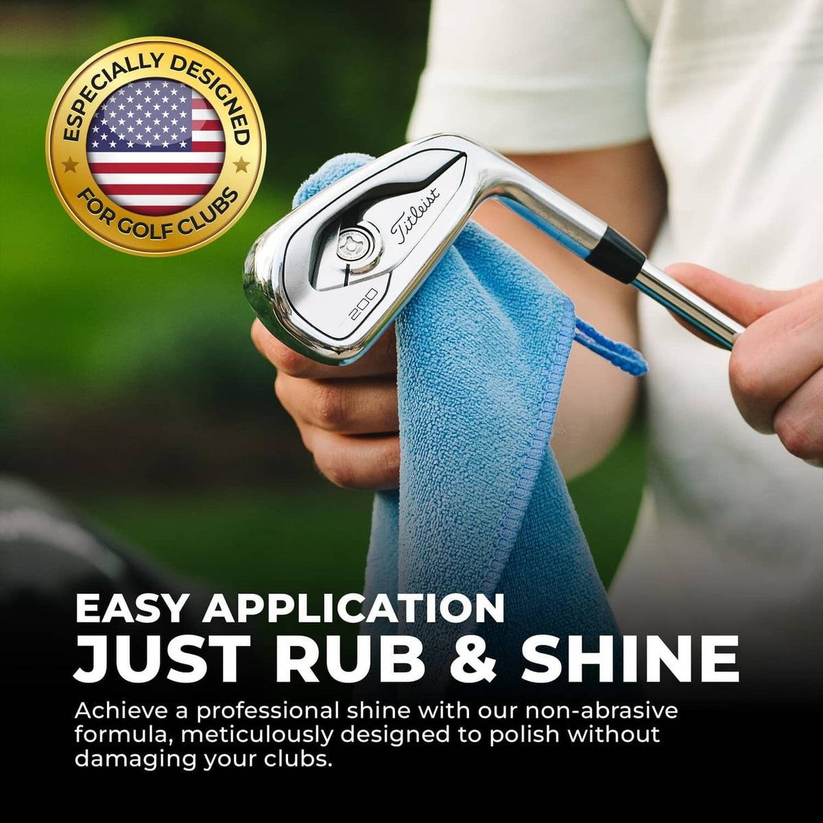 Hand polishing a golf club head with a cloth for shine and rust removal.