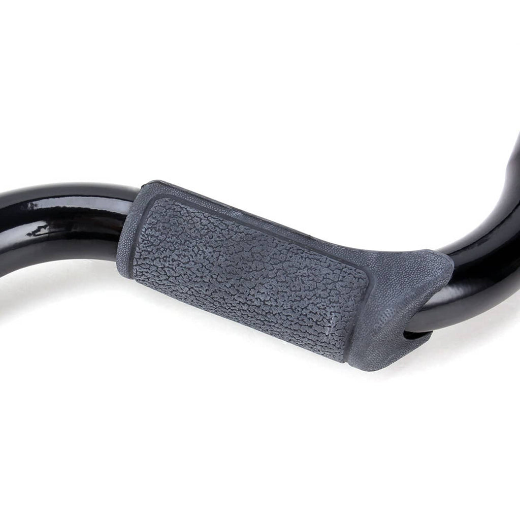 Motorcycle engine crash guard bar with textured gray rubber pad on black bar