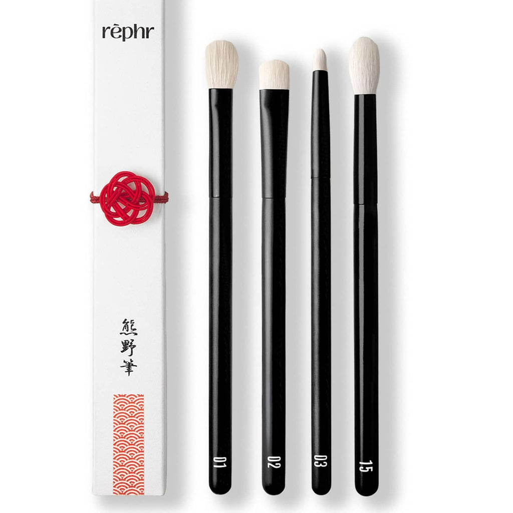 4 eye makeup brushes with black handles and cream goat-hair bristles in a sleeve