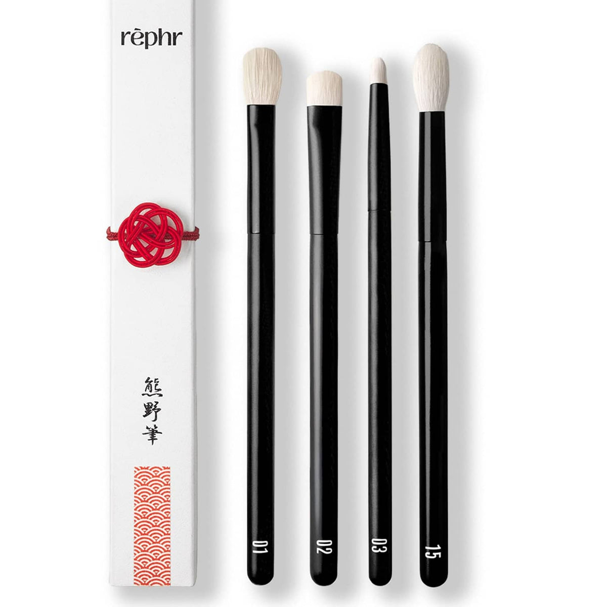 4 eye makeup brushes with black handles and cream goat-hair bristles in a sleeve