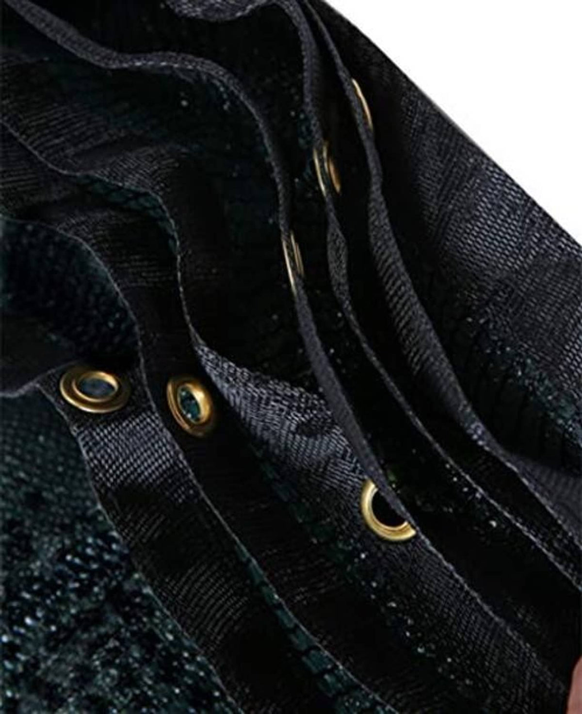 Black shade cloth with brass grommets and stitched hem, close-up