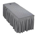 Grey quilted massage table skirt with pleated valance, fitted around table edges
