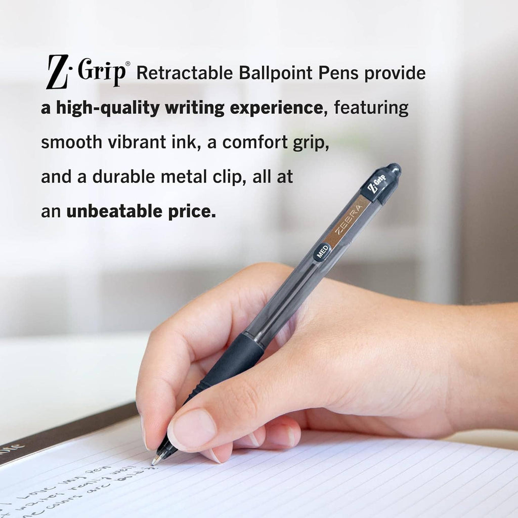 Hand holding a retractable ballpoint pen writing on paper.
