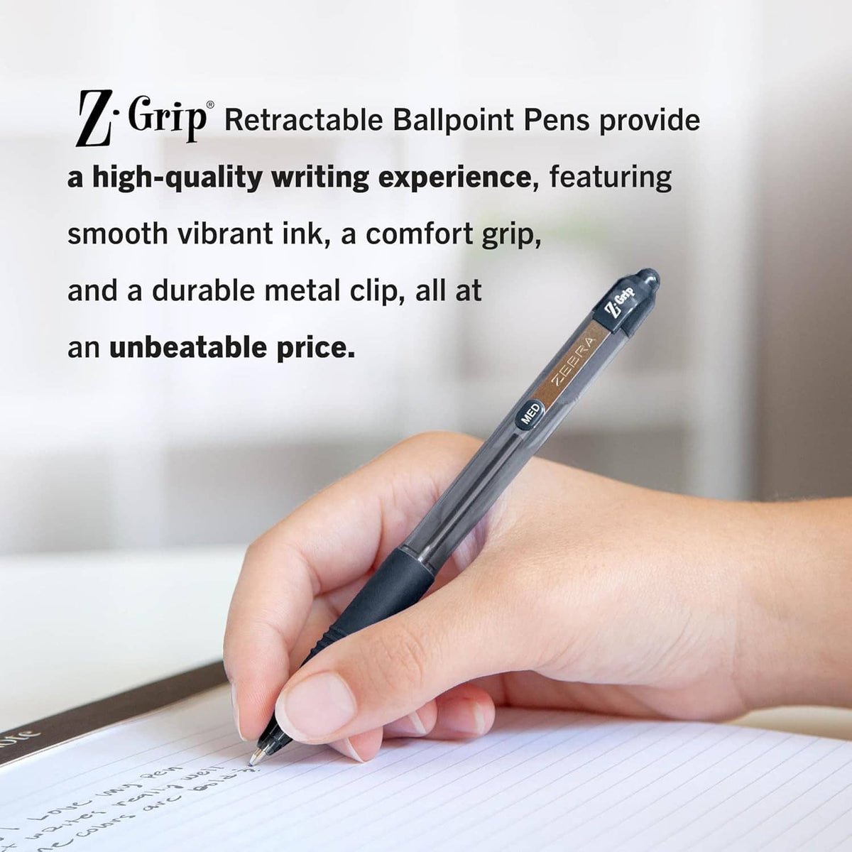 Hand holding a retractable ballpoint pen writing on paper.