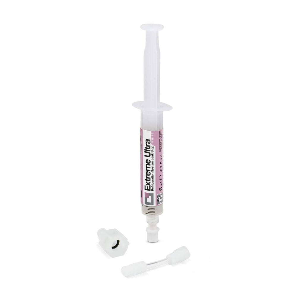 White sealant injector syringe with dispensing tip and small cap parts