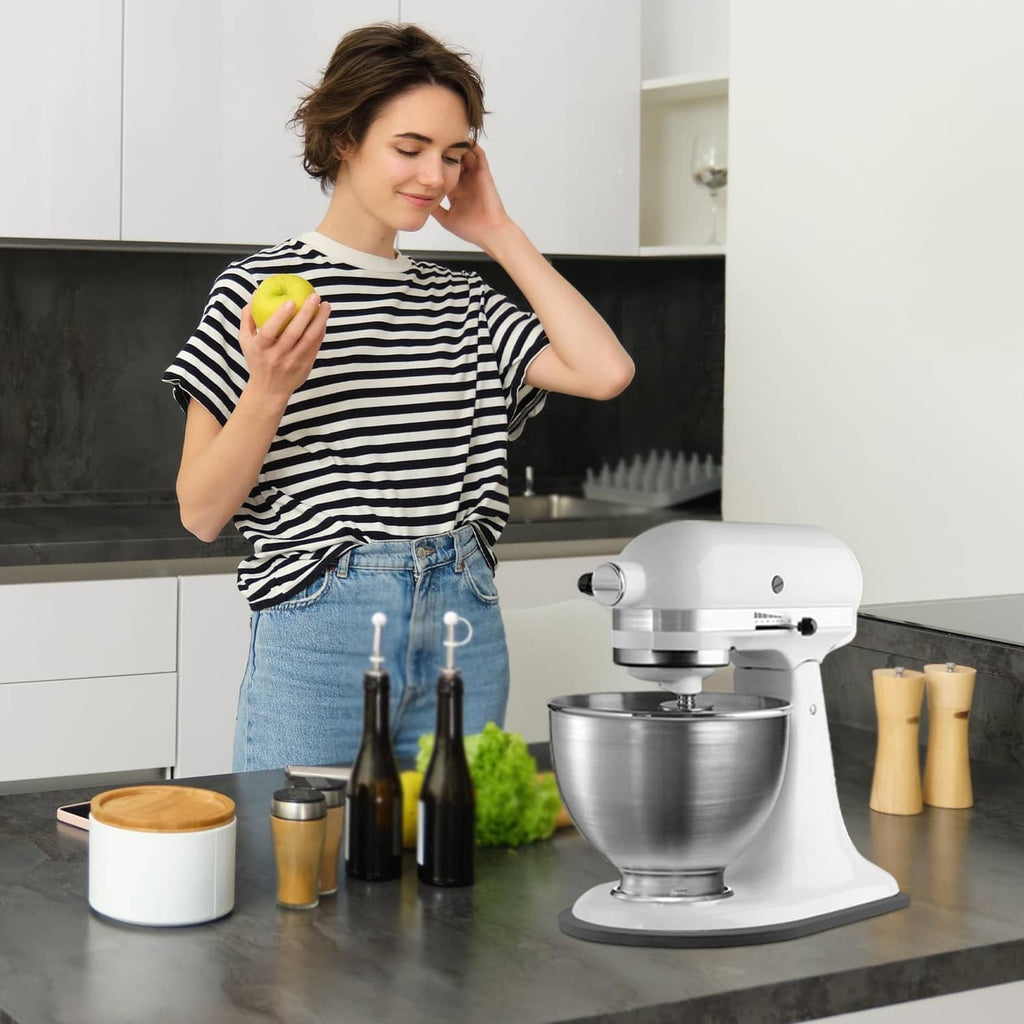 White stand mixer with bowl attachment accessory on countertop