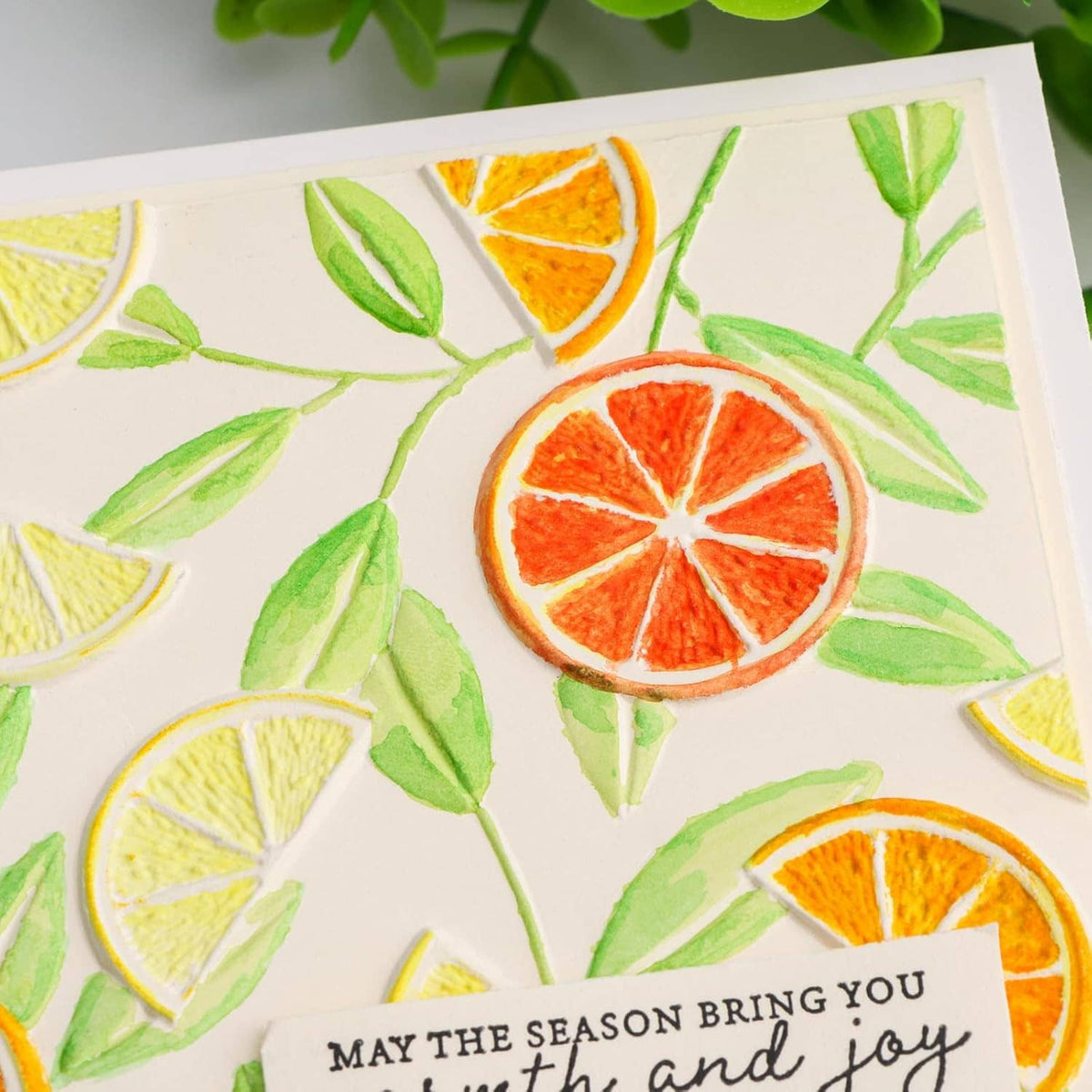 Embossed lemon and leaf pattern card with decorative sentiment circle