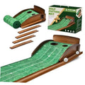 Indoor golf putting mat with green textured surface, brown rails, and 2 cup holes