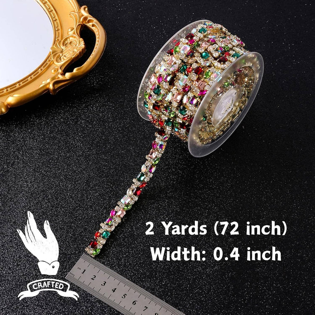 Rhinestone trim chain with multicolor crystals and gold setting, shown on spool with ruler