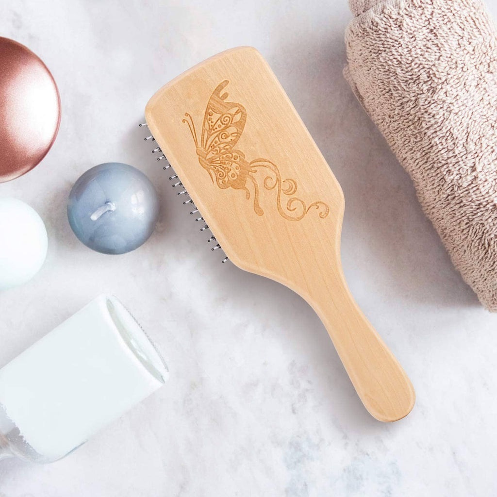 Natural wood boar bristle hair brush with floral engraving and black bristles
