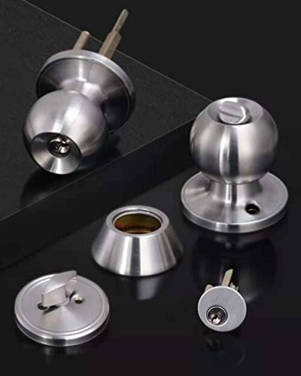Keyed deadbolt lockset components in brushed metal finish, including knobs and parts.